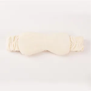 Detailed shot of the ultra-soft plush 2-in-1 headband and eye mask in beige cozy fabric.