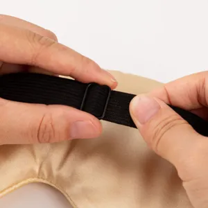 Double-sided imitation silk sleep mask with adjustable strap, breathable and shading for rest.