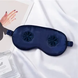 Dark blue imitation silk sleep mask featuring 3D flower embroidery, soft for travel and home.