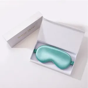 Silk eye mask detail view in gift box, smooth sleep mask for travel and office rest.