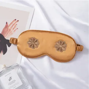 Imitation silk sleep eye mask with floral embroidery, breathable and comfortable for travel and home.