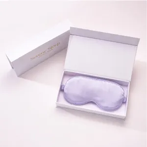 Luxury silk sleep eye mask in white gift box, soft satin material for comfortable travel rest.