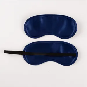 Close-up detail of dark blue satin sleep eye mask with comfortable black elastic strap.