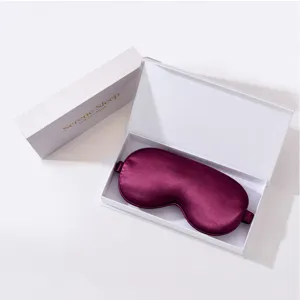 Burgundy silk eye mask with luxury white gift box for sleeping, travel and relaxation use.