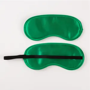 Solid green satin sleep mask with soft elastic strap for comfortable traveling and sleeping.