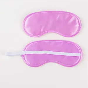 Detailed view of smooth pink satin sleep mask featuring soft fabric and elastic strap.
