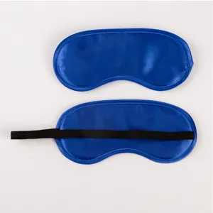Detailed view of blue satin sleep eye mask showing front and back sides with black strap