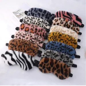 Detailed view of assorted plush animal print sleep masks with soft faux rabbit fur texture.