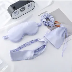 Silk satin sleep eye mask headband scrunchie pouch set detail view in elegant light purple.