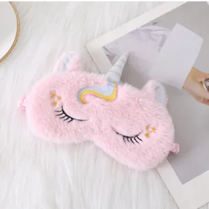 Cute pink unicorn plush sleep mask with soft faux rabbit fur and embroidery details for restful night.