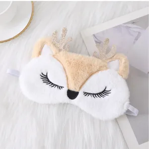 Cute plush reindeer sleep mask with glittering antlers and soft faux fur for cozy night rest.