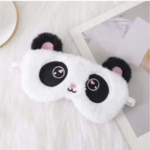 Close-up detail of the cute plush panda sleep mask with embroidery features and soft strap.