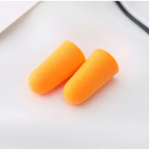 Slow rebound memory foam earplugs detail view, soft orange noise reduction sleep protection