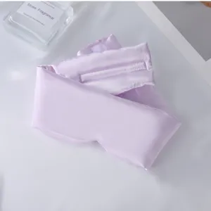 Antifaz de seda de color morado claro para un descanso cómodo, diseño opaco para viajes.