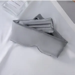 Máscara de dormir de seda gris, diseño opaco integral, cómoda para viajes y descanso en el hogar.