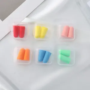Soft foam earplugs with portable plastic cases for sleeping and noise reduction.