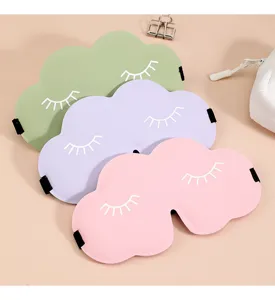 Close-up detail of 3D cloud sleep masks in pastel colors with cute eyelash print.