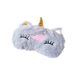 Masque de sommeil licorne en peluche douce avec cils brodés et corne dorée pour un bon repos.