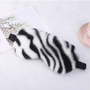 Soft plush zebra print sleep eye mask, comfortable blackout blindfold for home travel resting.