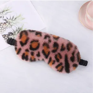 Soft pink leopard plush sleep mask detail view, cozy rabbit fur texture for comfortable home sleep.
