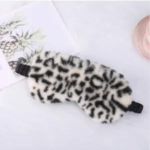 Cozy plush sleep mask with stylish leopard print, soft elastic strap for ultimate comfort and light blocking.
