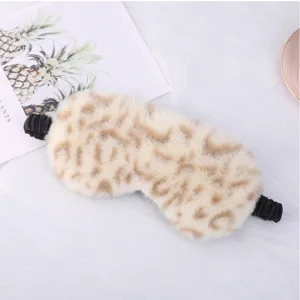 Close-up detail view of soft leopard print plush sleep mask featuring a comfortable elastic strap.