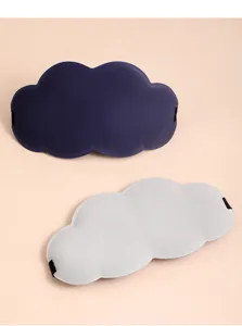 Close-up detail of the 3d cloud eye mask, showing soft memory foam texture and elastic strap.