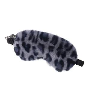 Grey leopard print plush sleep mask for comfortable home resting, soft night eye cover.