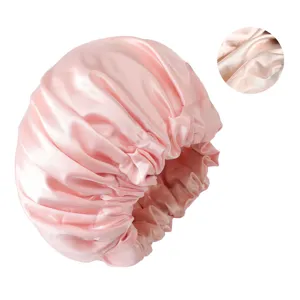 Pink satin sleep cap for women, soft double layer hair bonnet with wide elastic band.