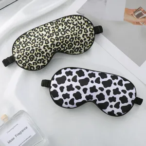 Soft silk sleep mask with stylish leopard and cow print for comfortable sleeping experience.