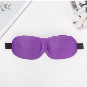 Close up detail of purple 3D contoured sleep mask with soft fabric and elastic strap.