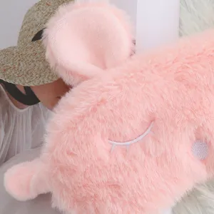 Cute plush bunny sleep eye mask with soft fluffy texture and sweet embroidery for night rest.