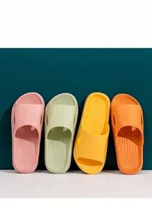 Close-up detail of colorful non-slip home slippers showcasing textured sole and soft material.
