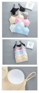 Detailed view of girls cotton camisole, wireless design with removable pads for comfort.