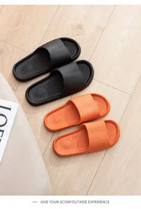Comfortable non-slip couple home slippers in black and orange, durable indoor soft sole shoes.