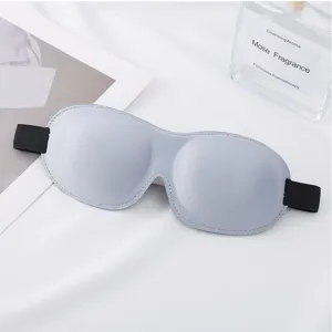 Masque de sommeil 3D gris avec design occultant et respirant pour les voyages confortables.