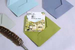Laser engraved lace triangle envelopes with vintage architectural sticker details.