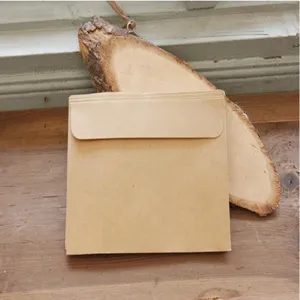 Detailed shot of brown kraft paper envelopes for card storage, minimalist retro plain style.