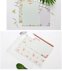 Cute stationery set with floral and cute fox patterns, including letter paper and envelopes.