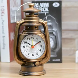 Detailed view of vintage lantern alarm clock, antique bronze finish and classic dial design.