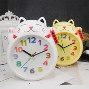 Cute cartoon cat alarm clock with colorful numbers and lucky charm, perfect for student desk decor.