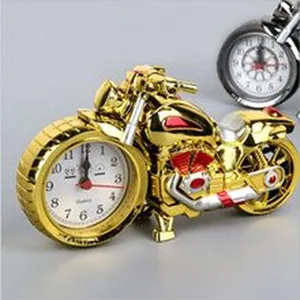 Detailed view of the creative motorcycle shape alarm clock dial, showing clear quartz design.