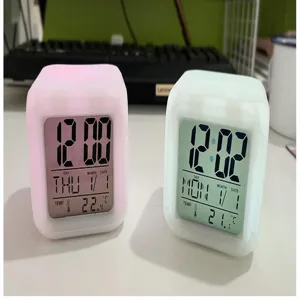 Detailed view of colorful square digital alarm clocks with LED night light, time and temp display.