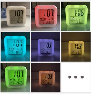 Color changing digital alarm clock with LED night light, temperature and calendar display.