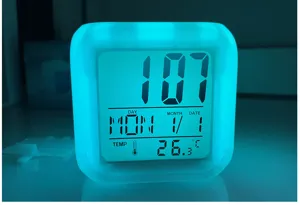 Multi-color glowing square digital LED alarm clock with temperature and time display details