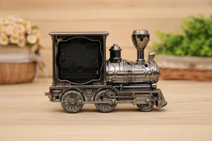 Vintage steam locomotive alarm clock, retro metal train table clock for home desk decor.
