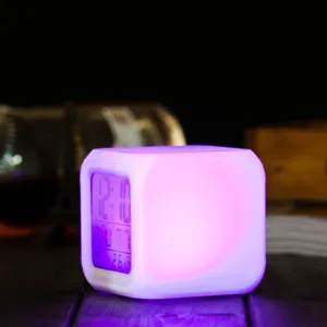 Detailed view of the colorful color-changing LED square digital alarm clock with glowing light.