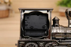 Vintage retro train alarm clock detail view, plastic model clock for home decor.