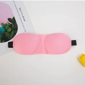Close-up of pink 3D contoured sleep mask detail, featuring ergonomic eye sockets and soft elastic band.