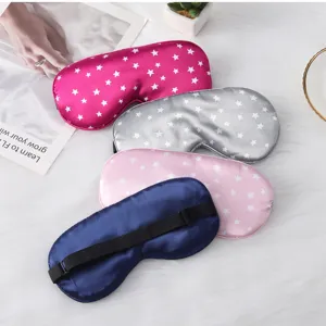 Details of the soft imitation silk sleep eye mask with adjustable strap and cute star prints.